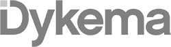 Gray logo of the word Dykema in a modern, sans-serif font on a light background, reflecting the professionalism suited for Class A office space San Antonio.